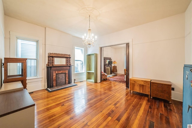 326 N 9th, Paducah, KY 42001 - living area featuring hardwood / wood-style flooring, a chandelier, and a fireplace