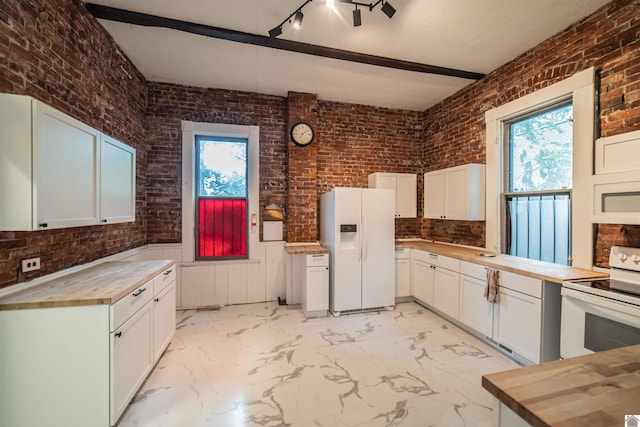 326 N 9th, Paducah, KY 42001 - kitchen with white appliances, butcher block countertops, brick wall, light marble finish flooring, and white cabinets