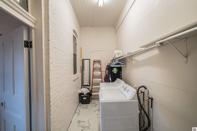 326 N 9th, Paducah, KY 42001 - washroom featuring washing machine and clothes dryer, marble look tile flooring, wood ceiling, and brick wall