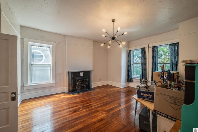 326 N 9th, Paducah, KY 42001 - living room featuring hardwood / wood-style floors, a wood stove, and a chandelier