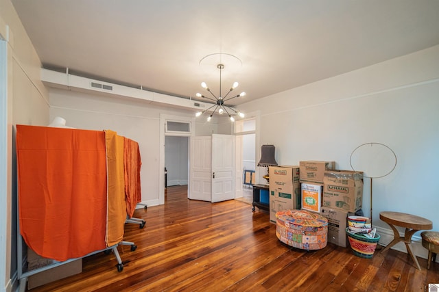 326 N 9th, Paducah, KY 42001 - miscellaneous room with dark wood-style flooring and a chandelier