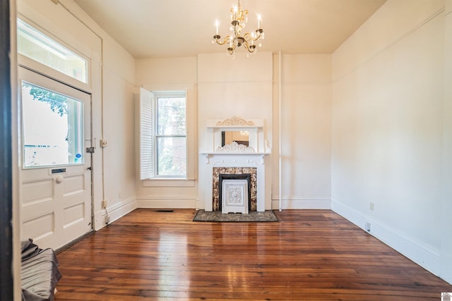 326 N 9th, Paducah, KY 42001 - unfurnished living room with a chandelier, wood-type flooring, and a fireplace