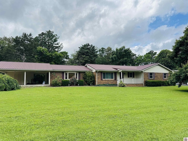 111 Cherry Grove Dr, Benton, KY 42025 - ranch-style house featuring covered porch, a front yard, a metal roof, and brick siding