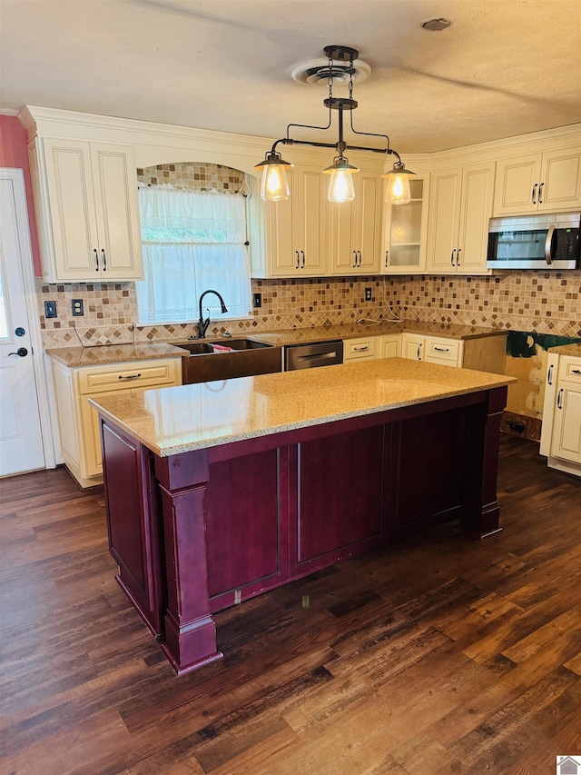 111 Cherry Grove Dr, Benton, KY 42025 - kitchen with appliances with stainless steel finishes, light stone countertops, dark wood-type flooring, and tasteful backsplash