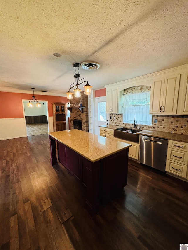 111 Cherry Grove Dr, Benton, KY 42025 - kitchen featuring stainless steel dishwasher, dark wood-style flooring, a center island, decorative backsplash, and a textured ceiling