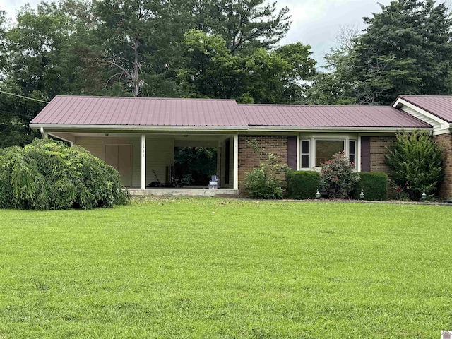 111 Cherry Grove Dr, Benton, KY 42025 - view of front of house with a front lawn, a metal roof, and covered porch