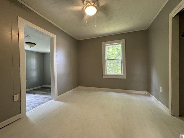 67 Beshear Ln, Princeton, KY 42445 - unfurnished room featuring light wood finished floors, ceiling fan, and crown molding