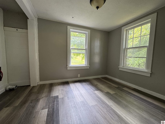 67 Beshear Ln, Princeton, KY 42445 - unfurnished room featuring wood finished floors and a textured ceiling