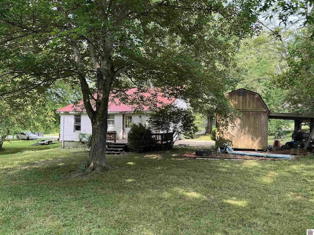 67 Beshear Ln, Princeton, KY 42445 - view of grassy yard with a shed and a wooden deck