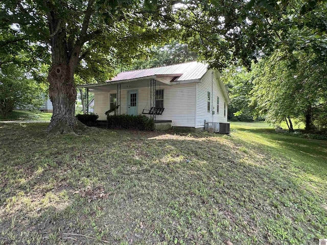 67 Beshear Ln, Princeton, KY 42445 - bungalow-style house with a porch, a front yard, and a metal roof