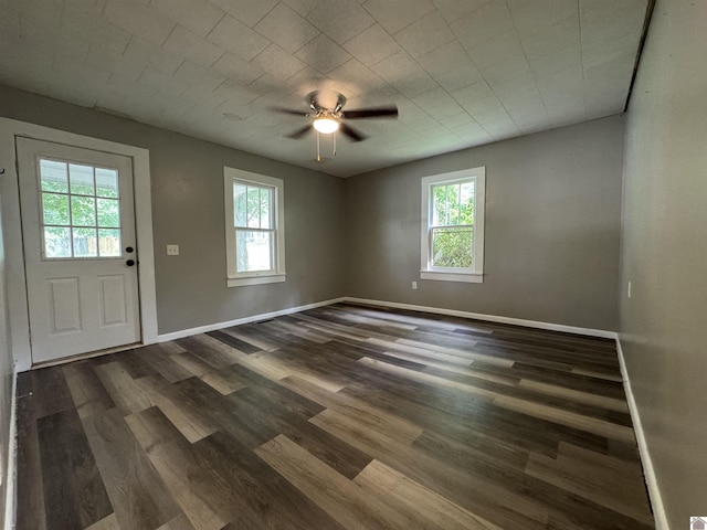 67 Beshear Ln, Princeton, KY 42445 - unfurnished room featuring plenty of natural light, a ceiling fan, and dark wood-style flooring