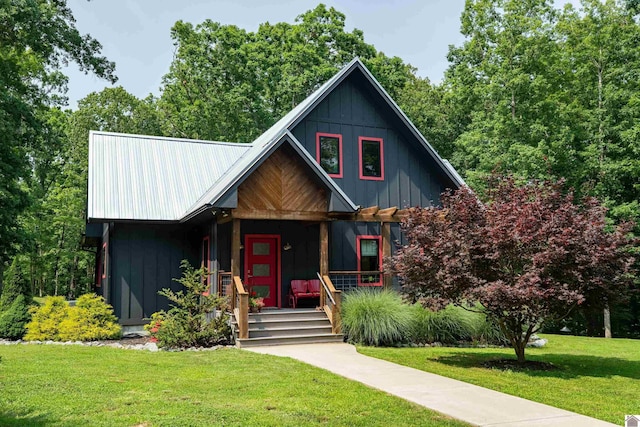 3431 Irvin Cobb Rd, Murray, KY 42071 - view of front of home featuring a porch, a front yard, board and batten siding, and a metal roof