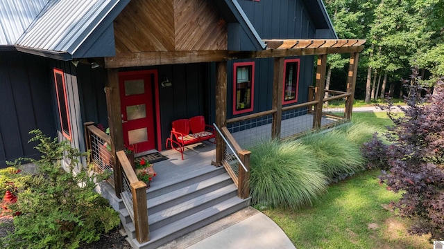3431 Irvin Cobb Rd, Murray, KY 42071 - view of exterior entry with board and batten siding, covered porch, and a metal roof
