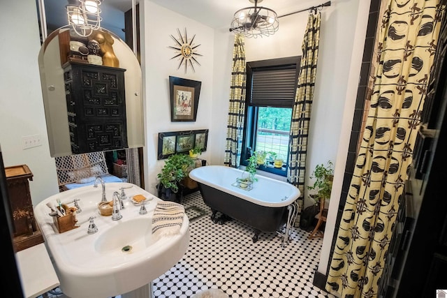 3431 Irvin Cobb Rd, Murray, KY 42071 - bathroom with a soaking tub and a chandelier