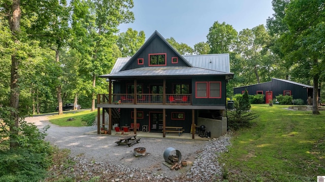 3431 Irvin Cobb Rd, Murray, KY 42071 - rear view of property with a lawn, a patio, a metal roof, a wooden deck, and french doors