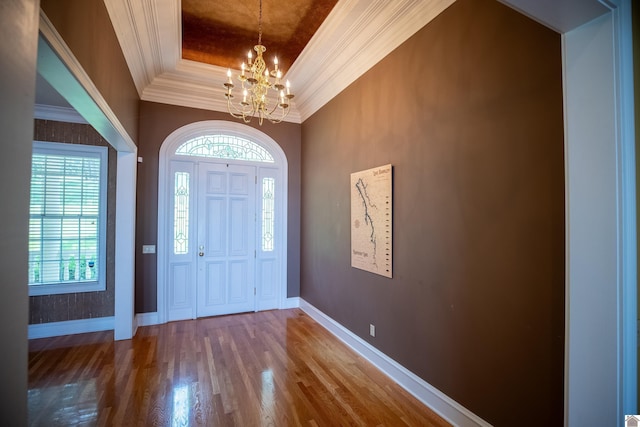 129 Wayne Cir, New Concord, KY 42076 - foyer with a tray ceiling, crown molding, a chandelier, wood finished floors, and healthy amount of natural light