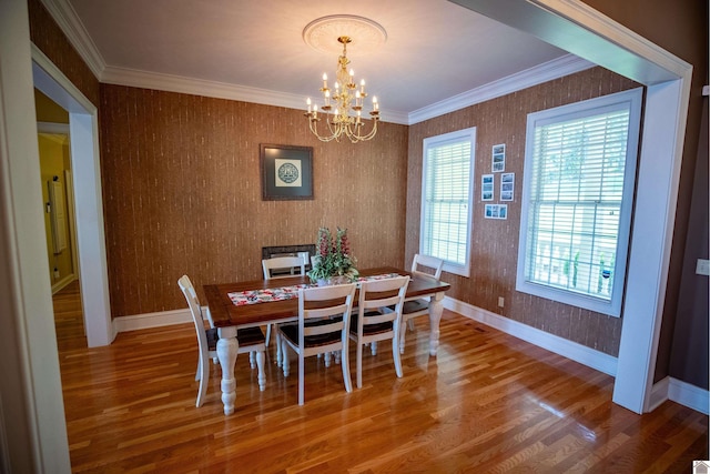 129 Wayne Cir, New Concord, KY 42076 - dining room featuring wood finished floors, a chandelier, and ornamental molding