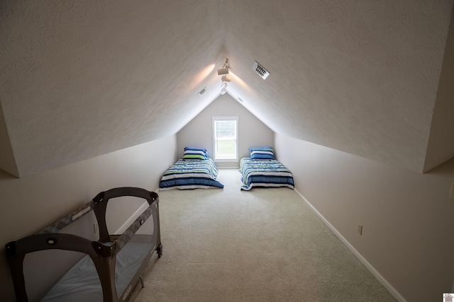 129 Wayne Cir, New Concord, KY 42076 - unfurnished bedroom with a textured ceiling, carpet floors, and vaulted ceiling