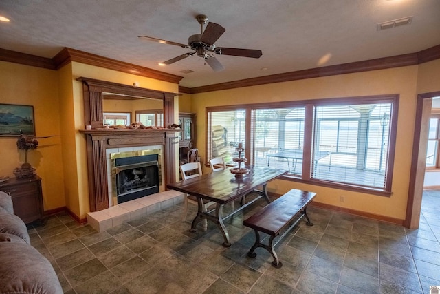129 Wayne Cir, New Concord, KY 42076 - dining area with ornamental molding, a fireplace, and ceiling fan