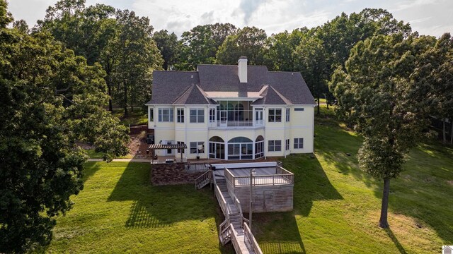 129 Wayne Cir, New Concord, KY 42076 - rear view of property featuring a balcony, stairs, a yard, a chimney, and a patio area