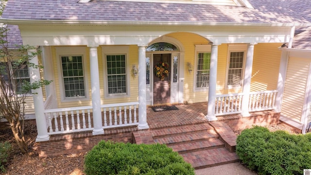 129 Wayne Cir, New Concord, KY 42076 - entrance to property featuring covered porch and a shingled roof