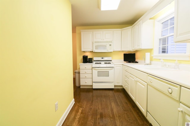 2567 Clay St, Paducah, KY 42001 - kitchen with white appliances, dark wood-style floors, white cabinets, and light countertops