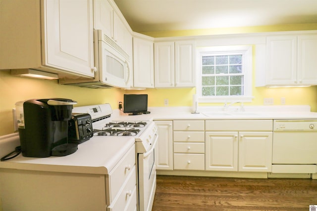 2567 Clay St, Paducah, KY 42001 - kitchen with white appliances, dark wood-style floors, white cabinetry, and light countertops