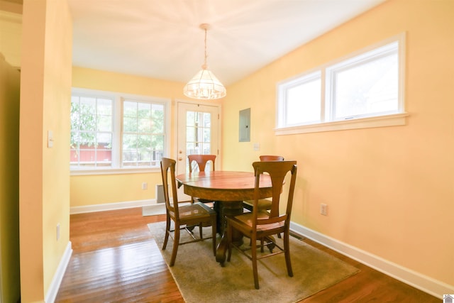 2567 Clay St, Paducah, KY 42001 - dining area with electric panel, dark wood-style floors, and a chandelier