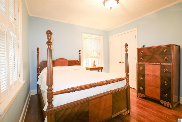 2567 Clay St, Paducah, KY 42001 - bedroom featuring dark wood-type flooring, ornamental molding, and a closet