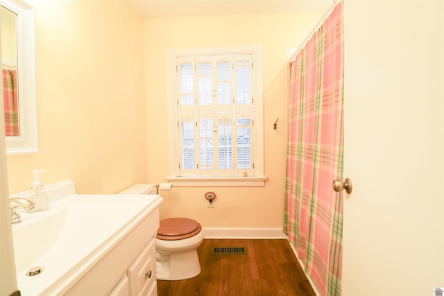 2567 Clay St, Paducah, KY 42001 - bathroom with vanity, wood finished floors, and a shower with shower curtain