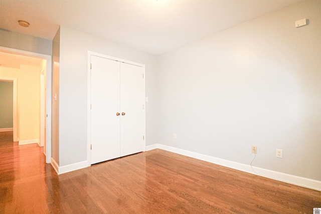 2567 Clay St, Paducah, KY 42001 - unfurnished bedroom featuring wood finished floors and a closet