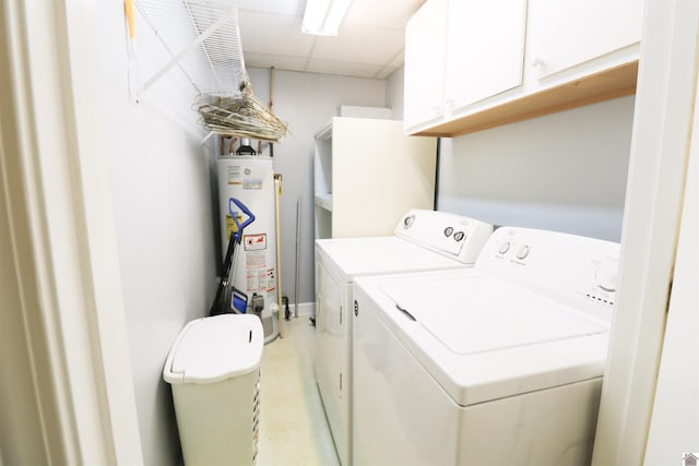 2567 Clay St, Paducah, KY 42001 - laundry room with water heater, washer and clothes dryer, and cabinet space