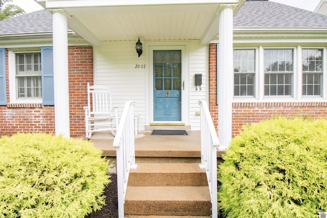 2567 Clay St, Paducah, KY 42001 - entrance to property featuring brick siding and roof with shingles
