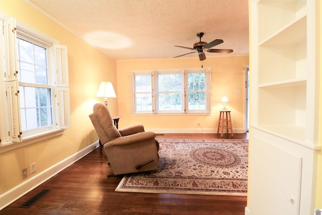 2567 Clay St, Paducah, KY 42001 - living area with a textured ceiling, dark wood-style floors, and ceiling fan