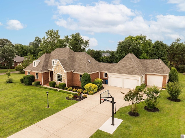 130 Camden Way, Paducah, KY 42001 - view of front of property with brick siding, driveway, a garage, and a front lawn