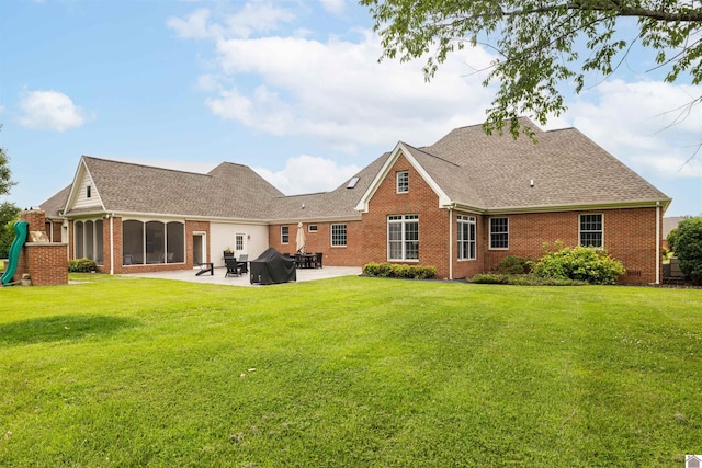 130 Camden Way, Paducah, KY 42001 - rear view of property with brick siding, a patio, a lawn, and roof with shingles