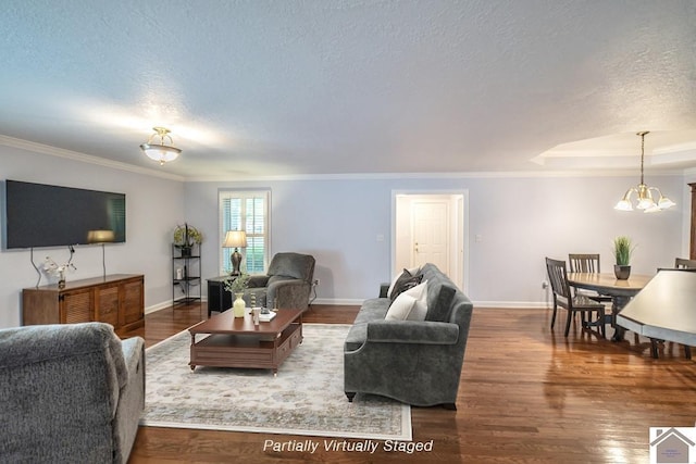 1530 Holt Rd, Paducah, KY 42001 - living area featuring a chandelier, a textured ceiling, wood finished floors, and ornamental molding