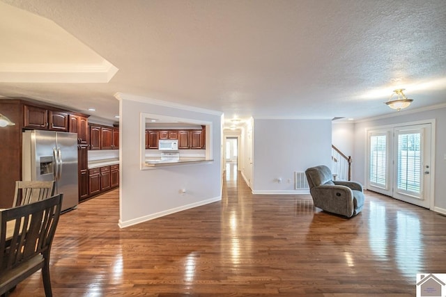 1530 Holt Rd, Paducah, KY 42001 - unfurnished living room featuring ornamental molding, dark wood-type flooring, stairway, a textured ceiling, and recessed lighting