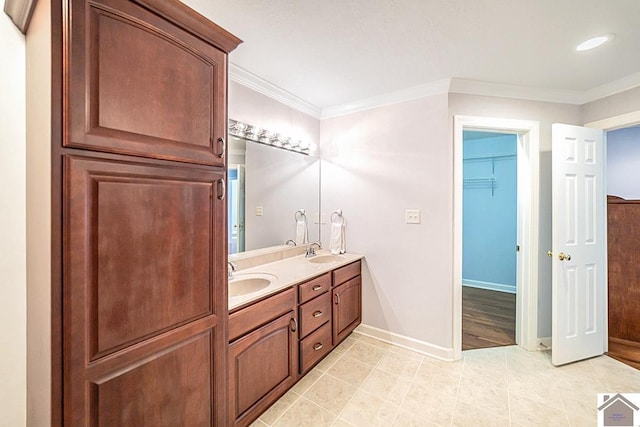 1530 Holt Rd, Paducah, KY 42001 - full bath featuring double vanity, tile patterned flooring, crown molding, a walk in closet, and recessed lighting