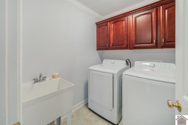 1530 Holt Rd, Paducah, KY 42001 - washroom featuring separate washer and dryer, cabinet space, crown molding, and light tile patterned floors