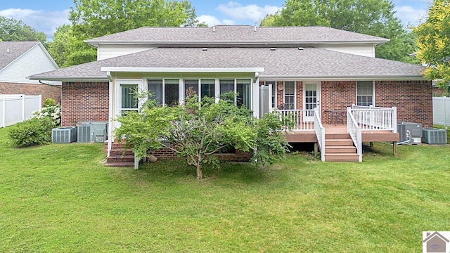 1530 Holt Rd, Paducah, KY 42001 - rear view of house featuring a shingled roof, brick siding, and a wooden deck
