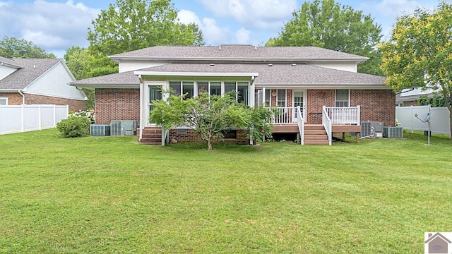1530 Holt Rd, Paducah, KY 42001 - rear view of property with brick siding, a fenced backyard, a deck, and roof with shingles