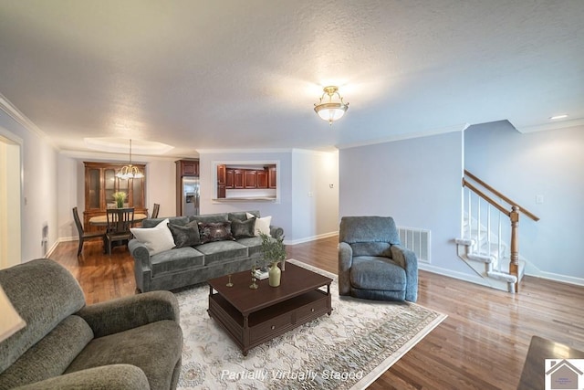 1530 Holt Rd, Paducah, KY 42001 - living room featuring wood finished floors, crown molding, and stairs