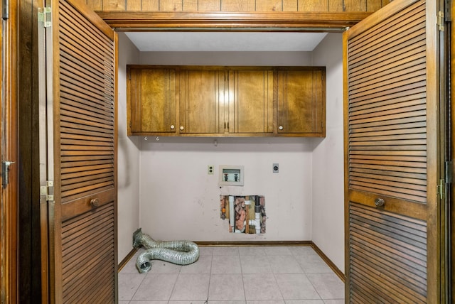 301 Tremont Dr, Hopkinsville, KY 42240 - laundry area with hookup for an electric dryer, cabinet space, hookup for a washing machine, and light tile patterned floors
