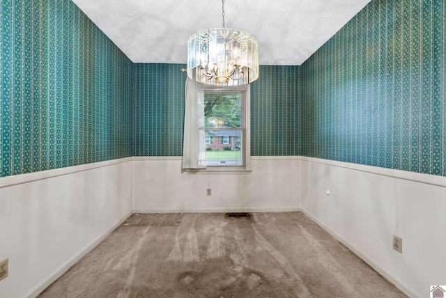 301 Tremont Dr, Hopkinsville, KY 42240 - spare room with wallpapered walls, a chandelier, wainscoting, and carpet