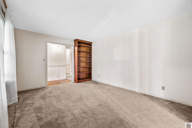301 Tremont Dr, Hopkinsville, KY 42240 - empty room with carpet, a textured ceiling, and built in features