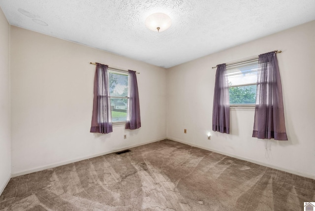 301 Tremont Dr, Hopkinsville, KY 42240 - unfurnished room featuring carpet floors and a textured ceiling