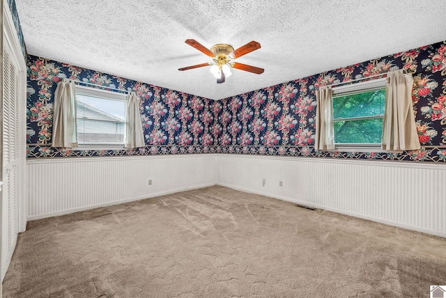 301 Tremont Dr, Hopkinsville, KY 42240 - spare room featuring a ceiling fan, a textured ceiling, and carpet floors