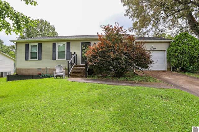 1040 Weda Cir, Mayfield, KY 42066 - view of front of house featuring driveway, a front yard, and a garage