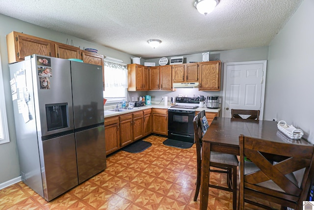 1040 Weda Cir, Mayfield, KY 42066 - kitchen featuring stainless steel fridge, electric range, under cabinet range hood, a textured ceiling, and light floors